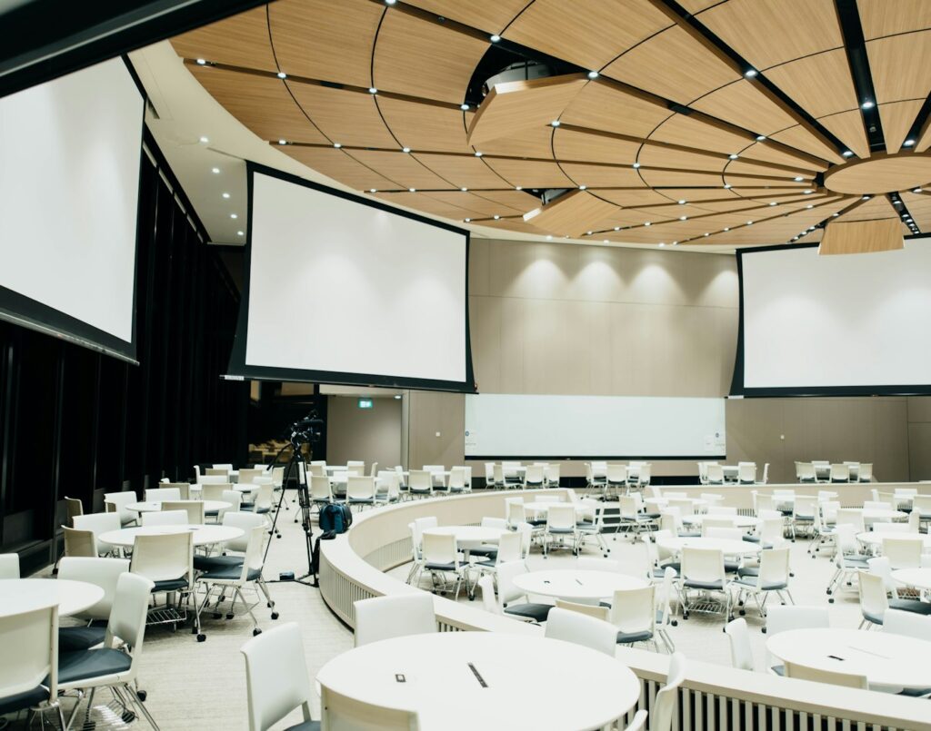 Event venue set up with round tables and chairs