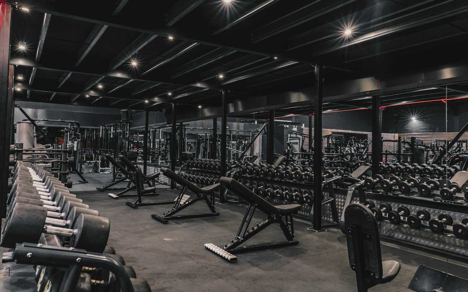 Weight room with strength training machines and free weights